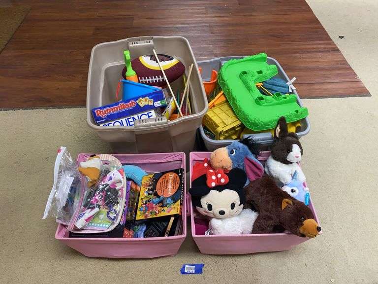 Four totes of toys and plush animals