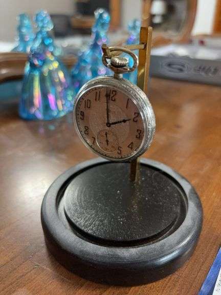 Elgin open face pocket watch in watch display dome