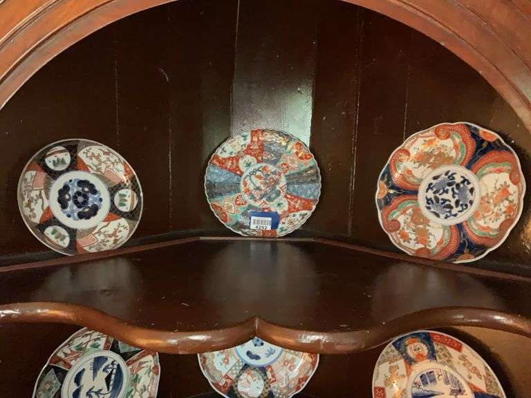 Contents of shelf: three Imari plates