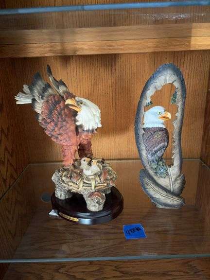Two bald eagle figurines