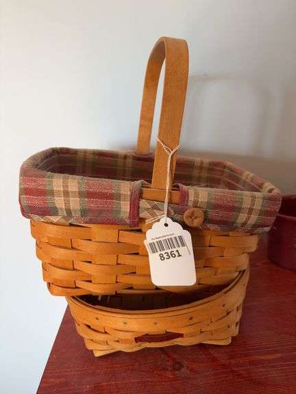 Two Longaberger baskets, one has fabric liner