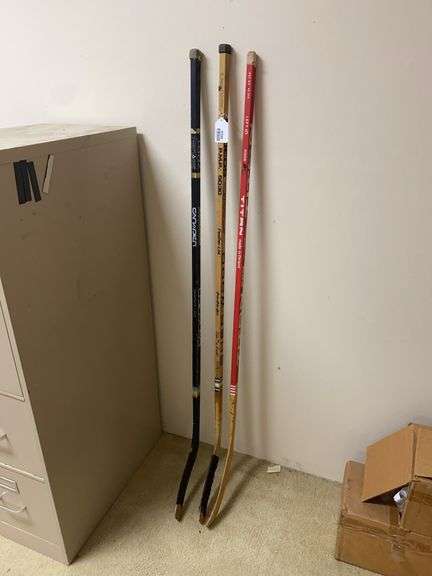 Three hockey sticks