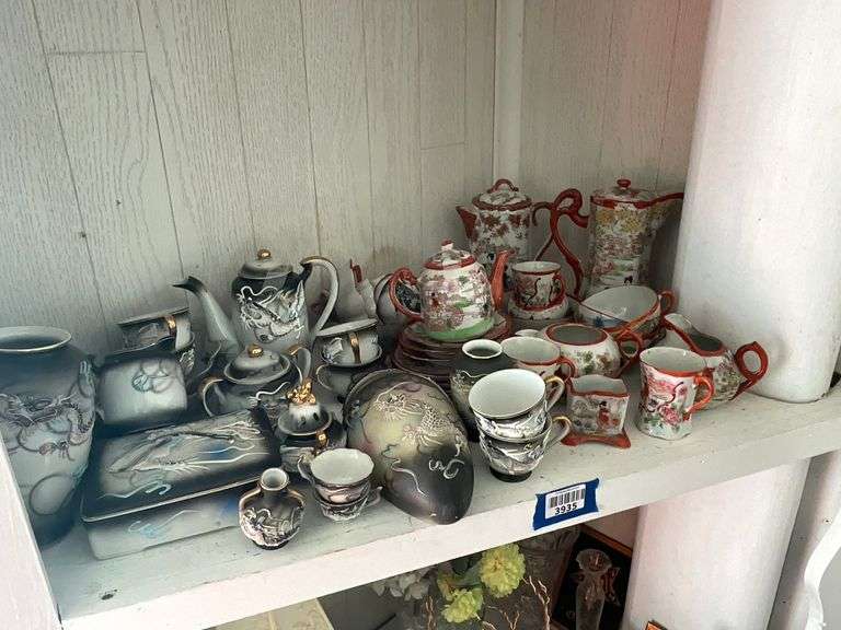 Contents of shelf: moriage dragonware including wall vase, and Geisha Girl china collection including chocolate pots