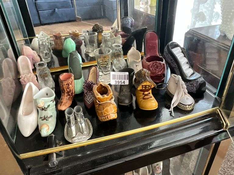 Contents of shelf: shoes in ceramic, glass, metal