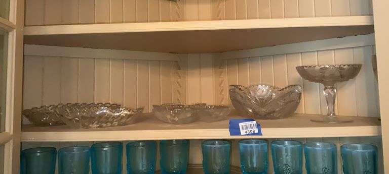 Contents of shelf: cut glass bowls, pedestal dish, relish dishes
