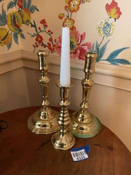 Three brass candlesticks: pair and one spare