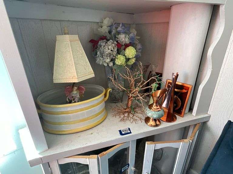 Contents of shelf: angel accent lamp, jadeite bud vase, wire tree sculpture, copperware, vases, misc