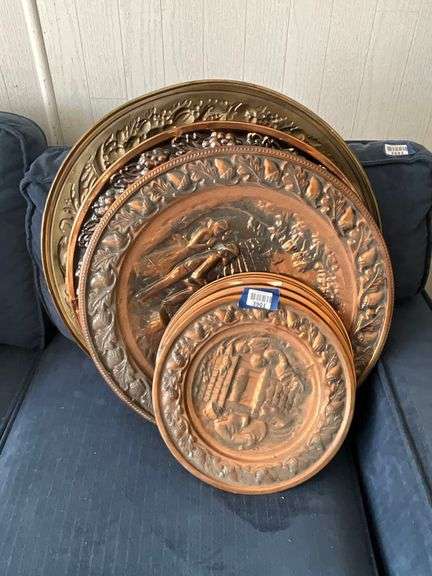Embossed copper and brass wall plaques