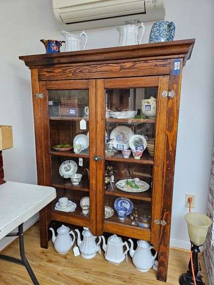 Cupboard top w/ molded cornice, two glazed doors, cast iron latch w/ porcelain knob, no contents 59 in h, 44 in w, 14 in d - MUST COME DURING LAST 2 HOURS OF PICKUP FOR THIS ITEM