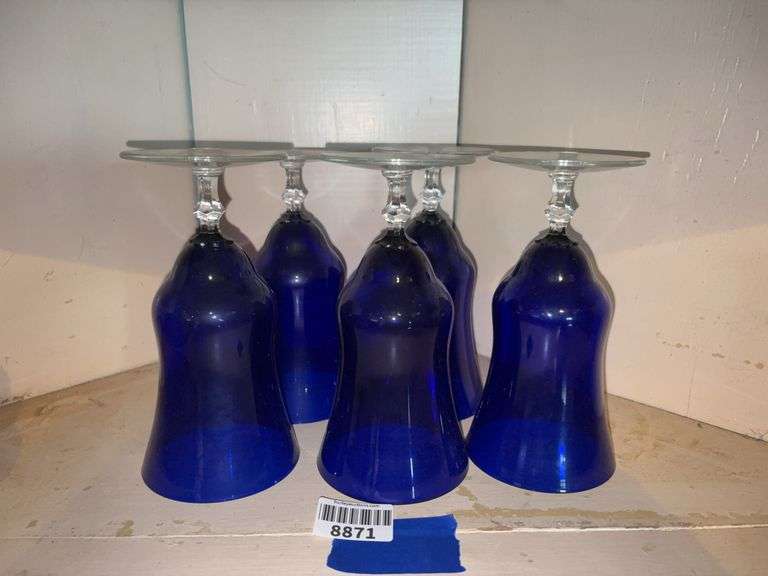 Five cobalt blue glasses on clear feet