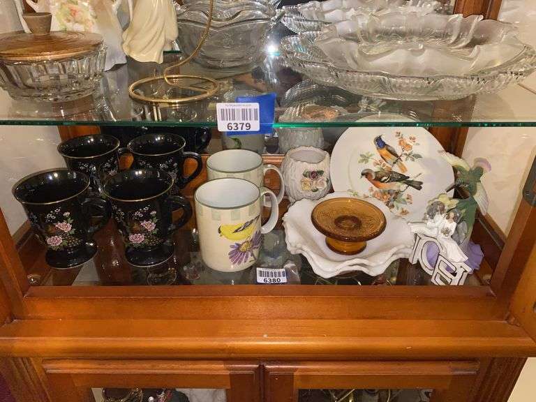 Contents of shelf: bird decorated mugs and plate, hummingbird figure, milk glass dishes, misc