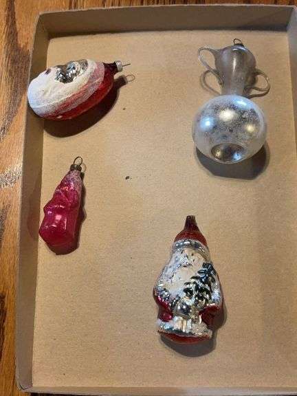 Four figural glass Christmas ornaments: Santas and sugar bowl