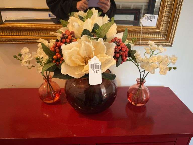 Faux flowers in glass vases