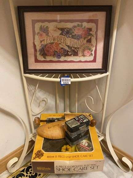 Contents of two shelves: Powder Room print, shoe stretcher and shoeshine kit
