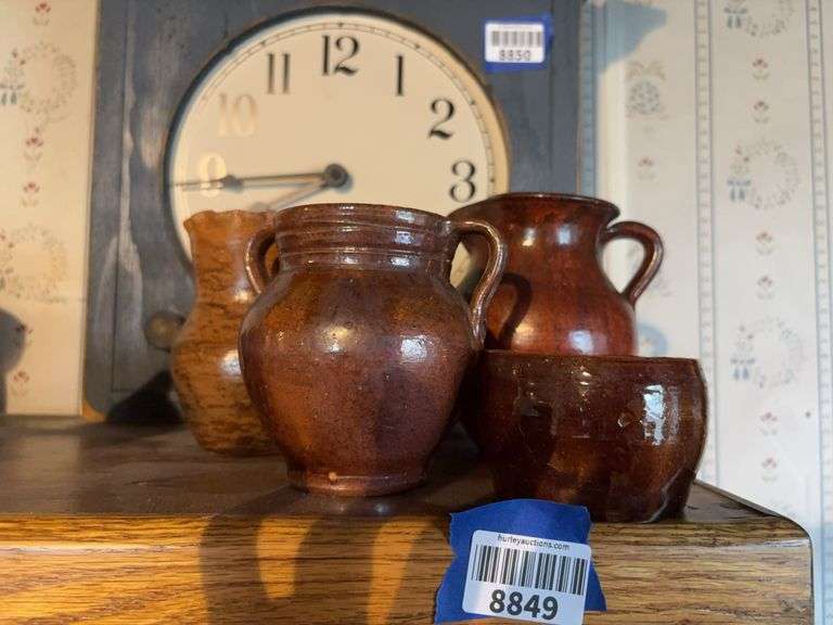 Pottery pitcher, vases, and bowl