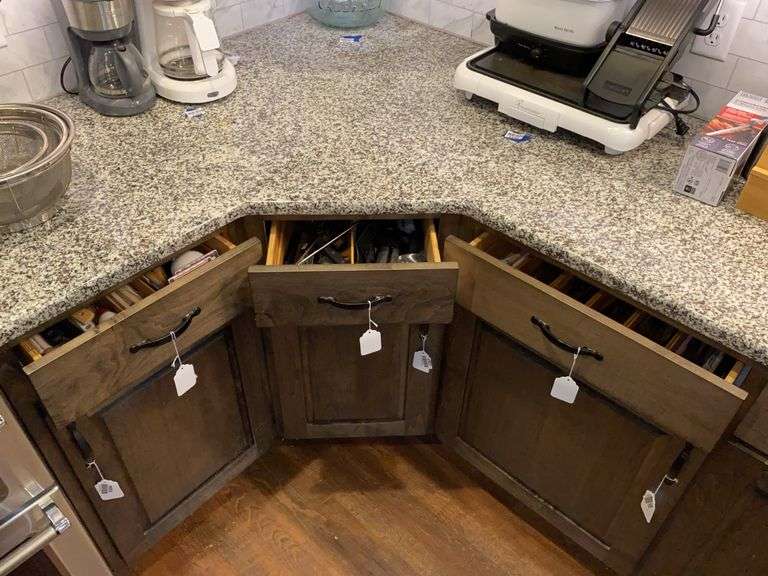 Contents of three drawers: utensils, flatware