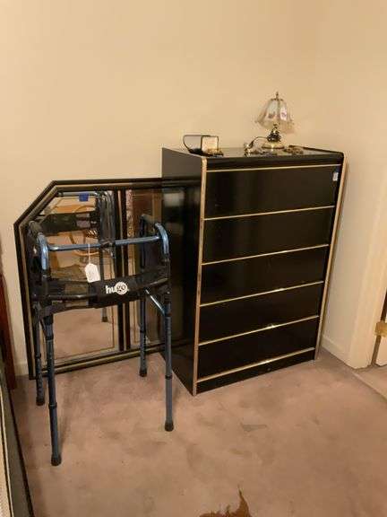 Black dresser with matching mirror behind it - no contents 32 x 17 x 47