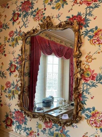 Shaped wall mirror in baroque pierced gilt frame 33x45
