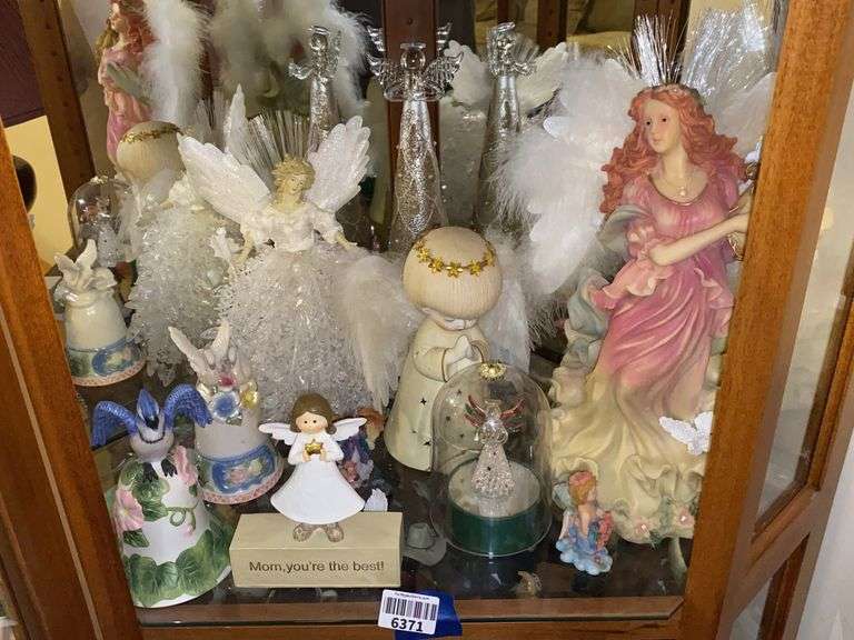 Contents of shelf: angel figurines