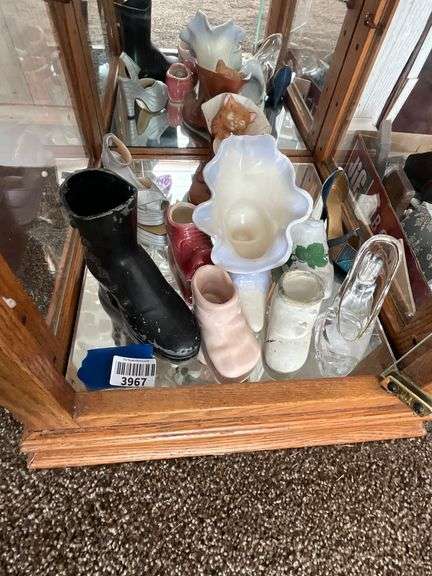 Contents of shelf: shoes in ceramic, glass, metal
