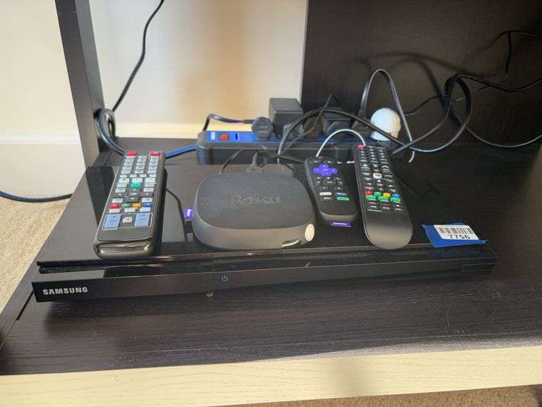 Samsung DVD player, Roku streaming device, remotes