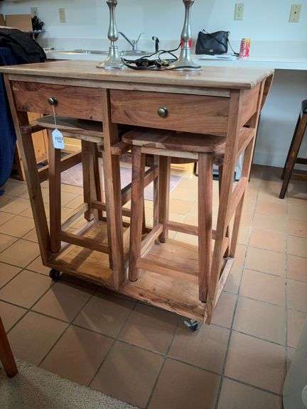 Rolling kitchen island w/ drop leaf on one side, drawer on the other, and two stools underneath - no top contents 34.5x20x37