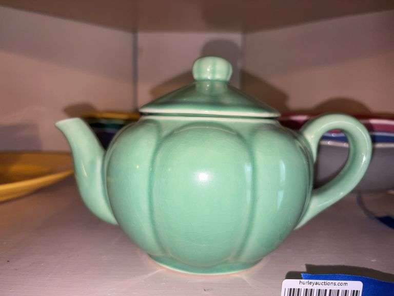 Green glazed pottery teapot - note chip on lid