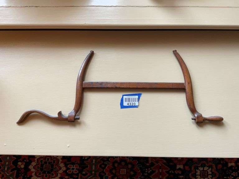 Handcrafted wooden bow saw