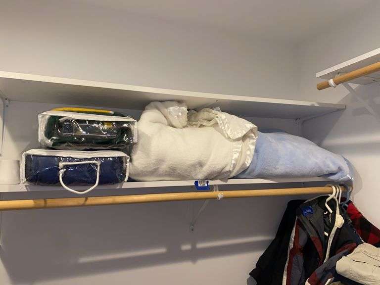 Contents of shelf: blankets