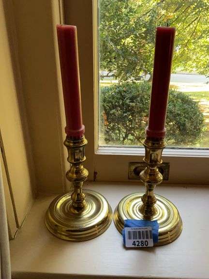 Pair of brass candlesticks w/ round bases, w/ candles