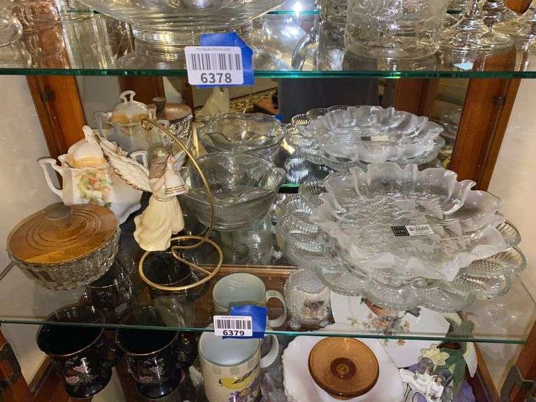 Contents of shelf: Mikasa glass dish, deviled egg plate, angel ornament, holly china sugar bowl, glass bowls