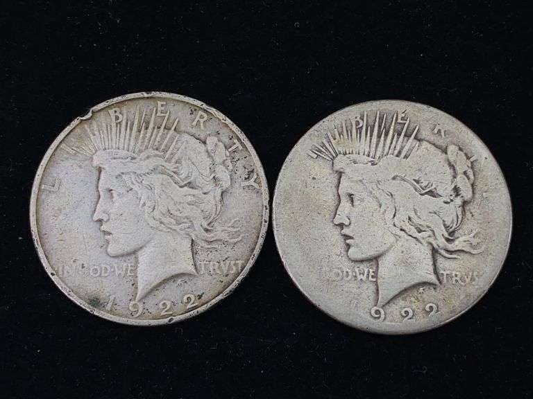 Two 1922 Peace silver dollar coins - by the pc take two