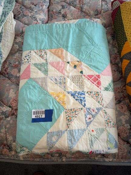 Patchwork quilt on pale blue ground