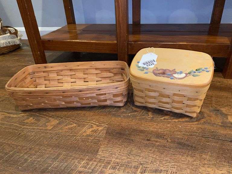 Two Longaberger baskets, one has painted wood lid