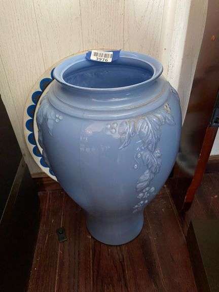 Glass floor vase painted blue inside, and hex sign