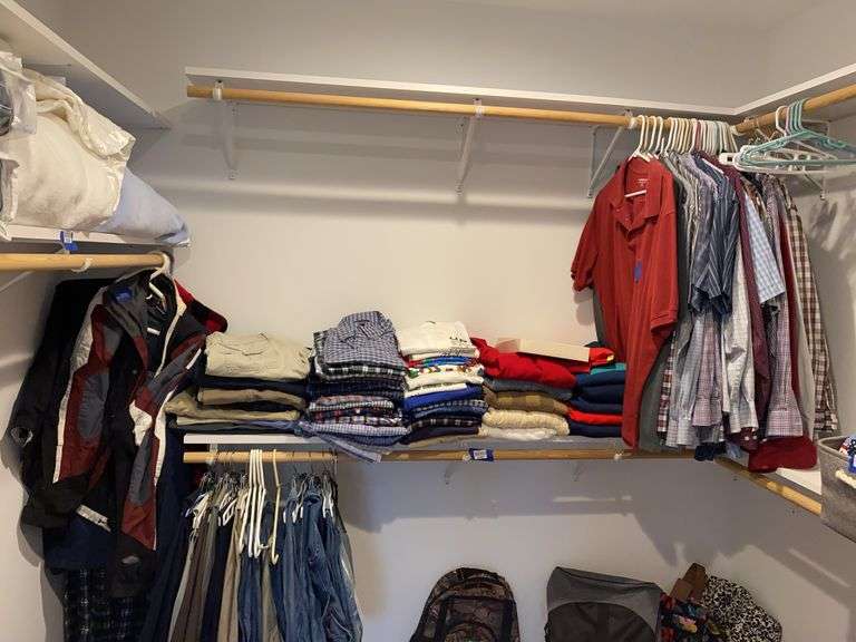 Men's clothing on shelf, hangers, and closet floor: shoes, socks, neckties
