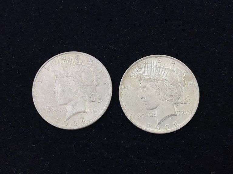 Two 1922 Peace silver dollar coins - by the pc take two