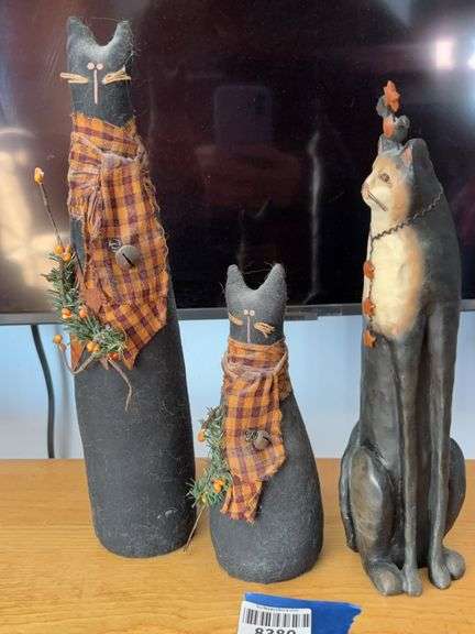 E. Smithson resin cat figure, and two canvas black cats