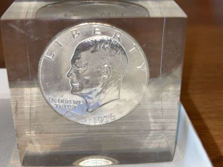 1776-1976 Eisenhower dollar coin encased in paperweight