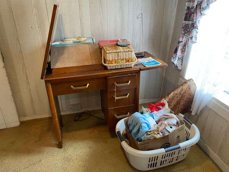 Super Zig Zag cabinet sewing machine, sewing boxes, and basket of fabric and trims 41x18.5x31