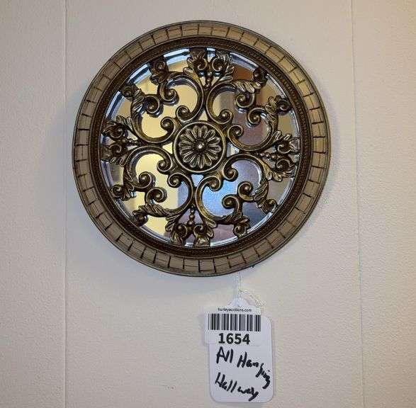 All wall hangings in hallway: mirrors, plaque, print