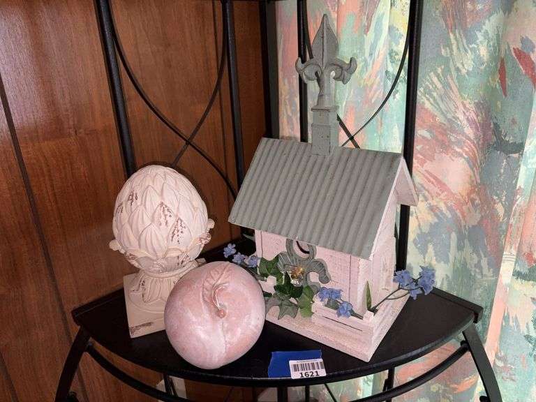 Decorative birdhouse, pineapple and apple