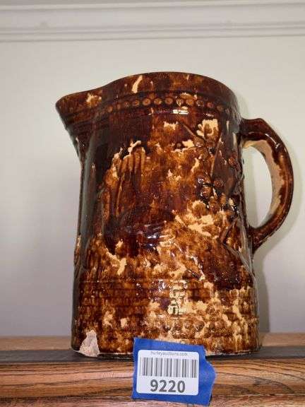 Rockingham glazed peacock molded yellow ware pitcher