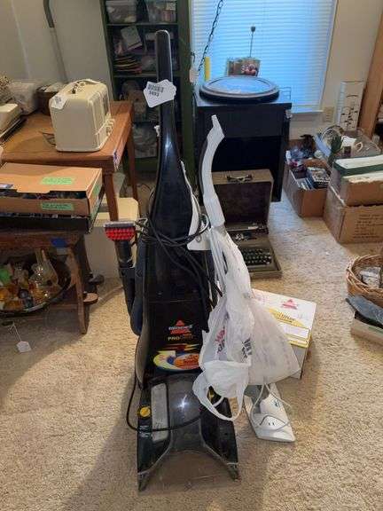 Bissell ProHeat vacuum, Bissell SpotLifter hand vac in box, Steamfast steamer