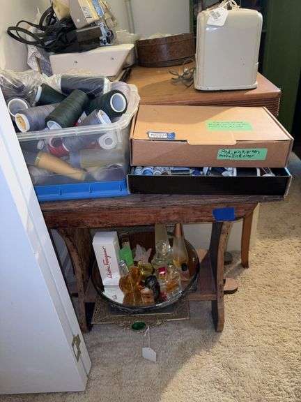 Table and contents: plateau mirror, mirrored dresser tray, perfume bottles, thread