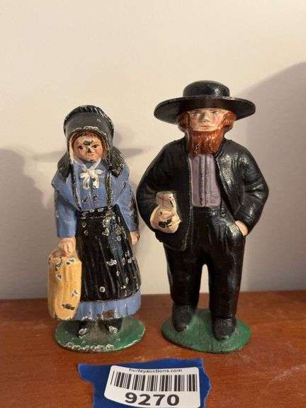 Cast iron Amish couple figurines