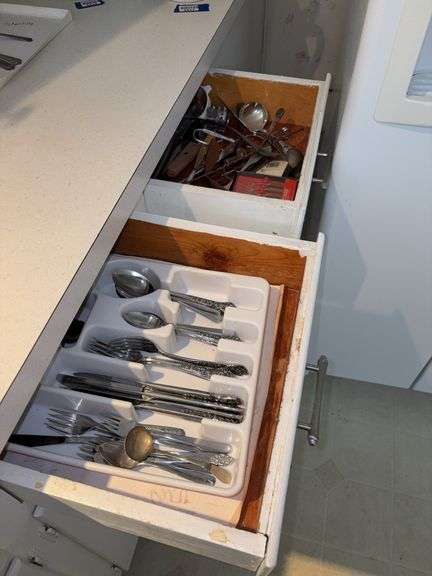 Contents of two kitchen drawers - flatware & kitchen utensils