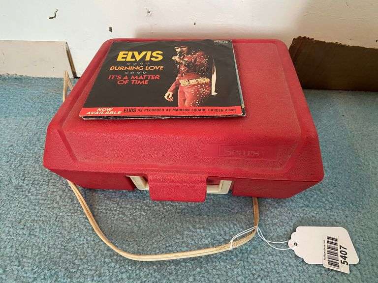 Elvis 45rpm records in picture sleeves, and vintage Sears record player
