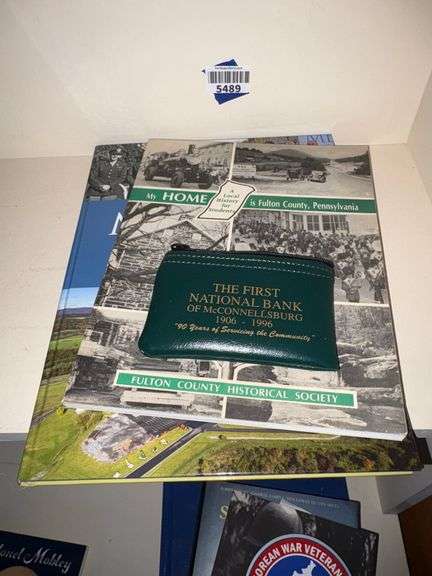 Two books My Home is Fulton County Pennsylvania & Mellott Company A Century of Success, First National Bank of McConnellsburg Bank Bag