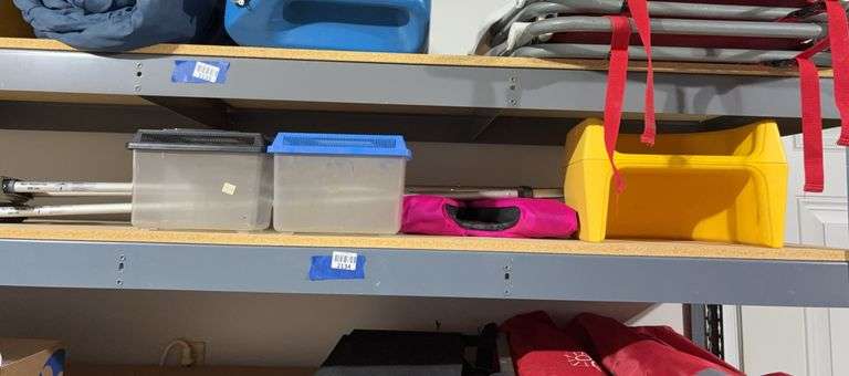 Contents of garage shelf -  booster seat, Walker & more